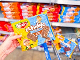 hand holding keebler el fudge cookies on walmart cart