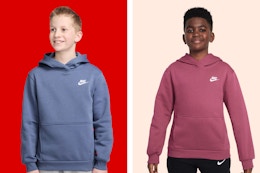 two kids wearing nike sweatshirts