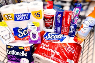 shopping cart with scott and cottonelle paper products, febreze air fresheners, colgate products, crest toothpaste, and oral-b toothbrushes