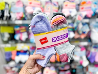 hand holding a hanes kids' 20-pack of socks at target