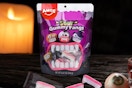 Amos Gummi Vampire Teeth Halloween Candy sitting on a tabletop.