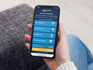 a person looking at prime student on their iphone