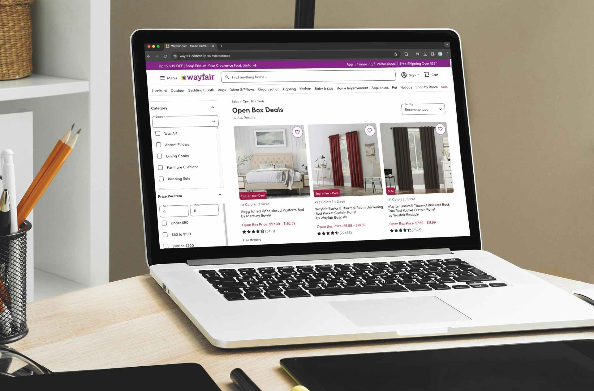 a laptop displaying the open box deals page on wayfair