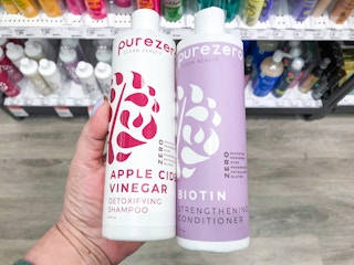 target purezero shampoo and conditioner hand holding