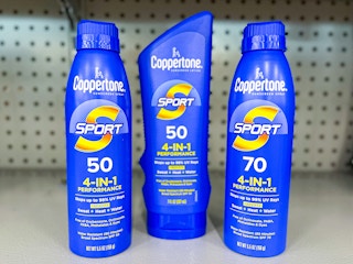 two Coppertone Sport sprays and one Coppertone Sport lotion on shelf