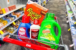 gain, persil, colgate, and reese's puffs in a cart