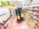 hand holding tresemme hairspray in walgreens