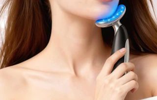 a person using a light therapy face massager