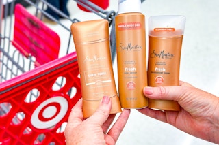 hand holding 3 sheamoisture deodorant at target
