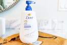 Dove body wash with pump  on top of Prime bag in bathroom