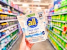 all detergent might pacs (19 count bag) held up in Walmart laundry aisle