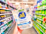 all detergent might pacs (19 count bag) held up in Walmart laundry aisle