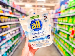 all detergent might pacs (19 count bag) held up in Walmart laundry aisle