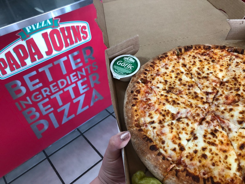 A Papa John's pizza in store.