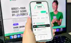 hand holding smartphone looking at a website
