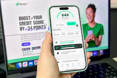 hand holding smartphone looking at a website