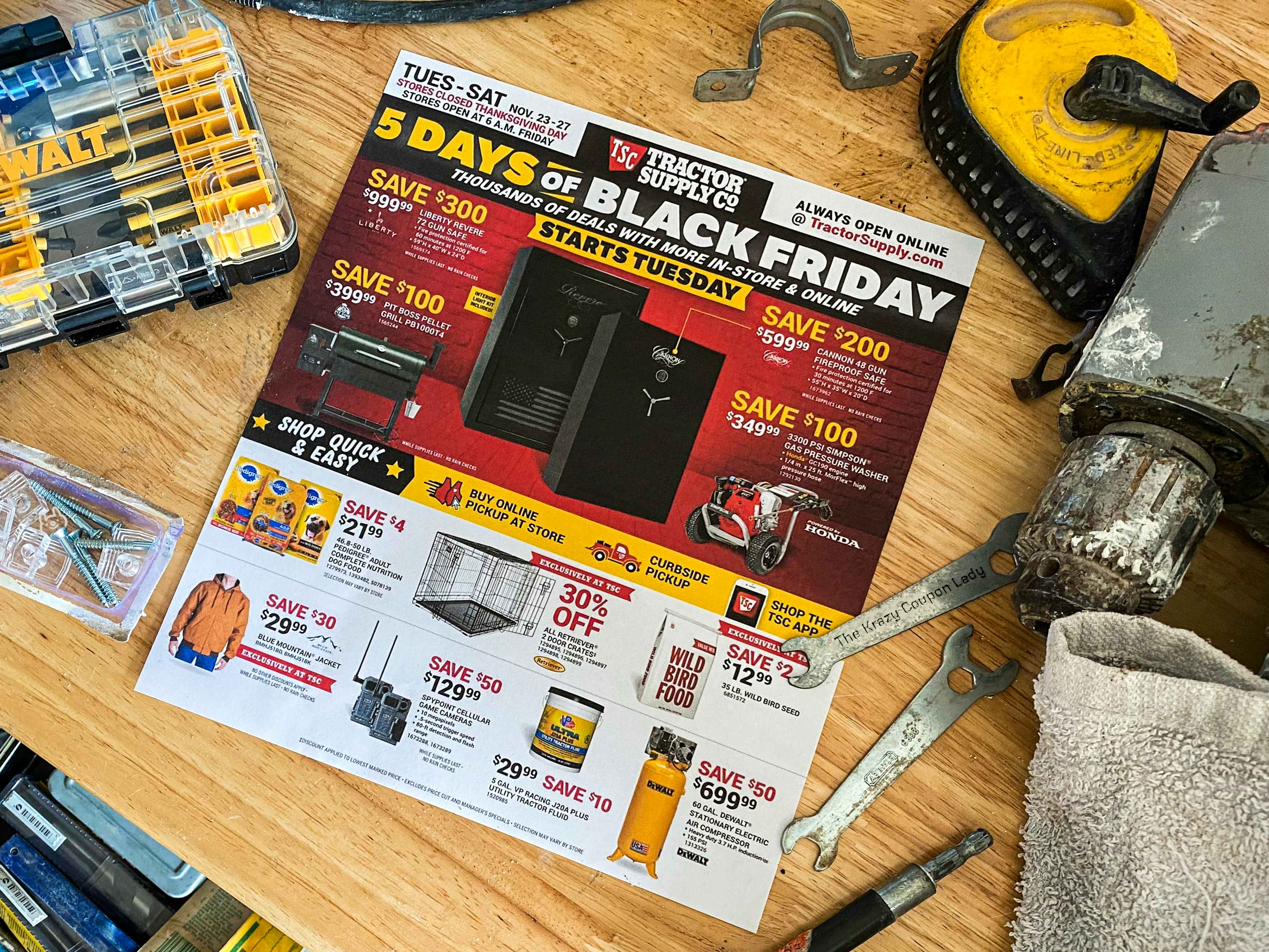 A Tractor Supply Co 2021 Black Friday ad sitting on a work bench surrounded by tools.