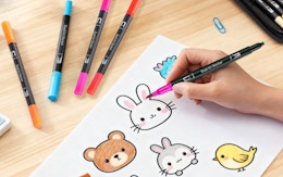 a hand coloring with markers