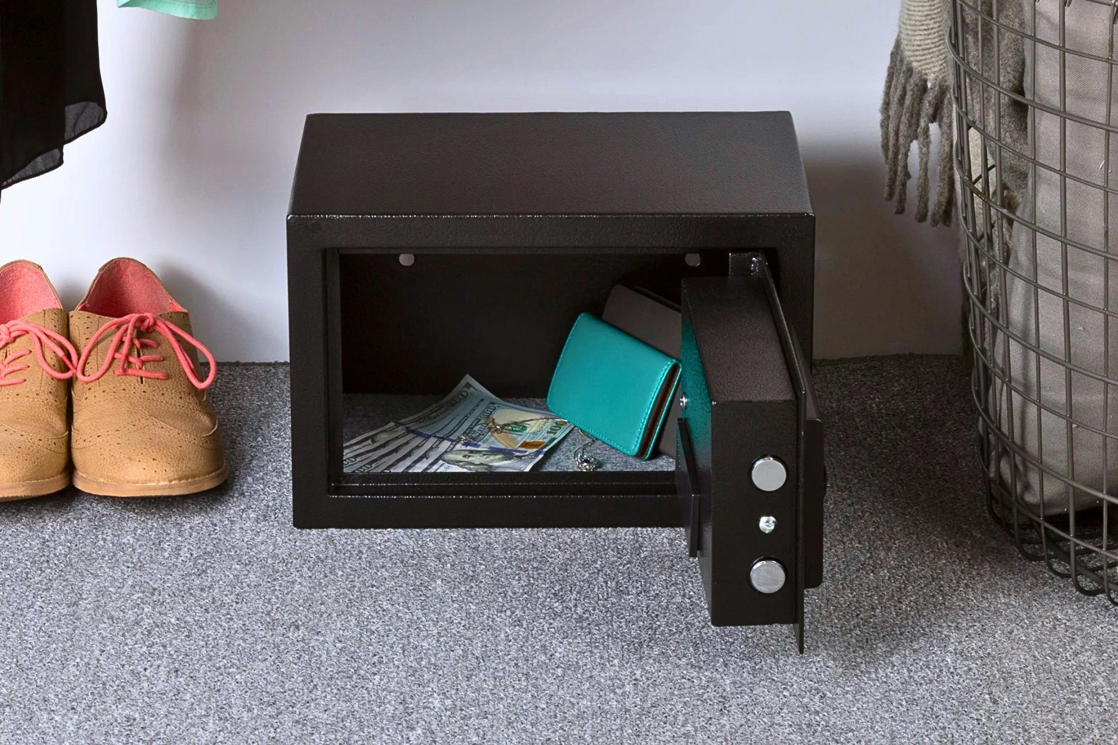 Lifestyle image of the Stalwart Steel Digital Safe on the floor in what appears to be a closet