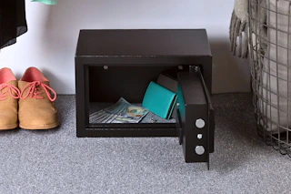Lifestyle image of the Stalwart Steel Digital Safe on the floor in what appears to be a closet