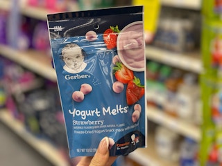 hand holding gerber yogurt melts in cvs aisle