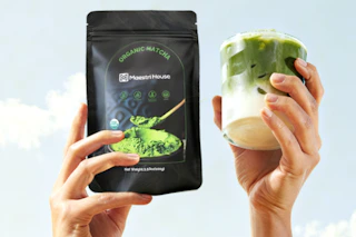 hands holding matcha powder and drink