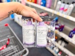 hand holding olaplex hair products in cvs