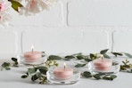 lifestyle image of tealight candles lit