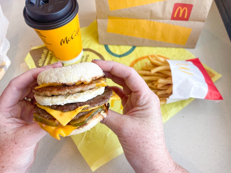 a mcdonalds secret menu mcmuffin being held