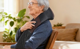 a person wearing a neck massager
