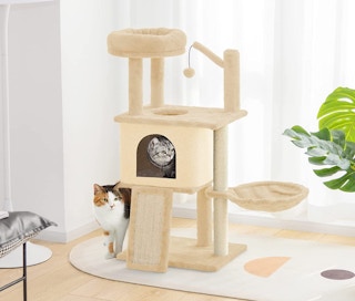 beige cat tree in a room