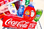 coca-cola, febreze, crest, tide, and dawn products in a cart
