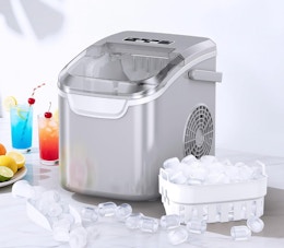 a grey ice maker next to a container of ice and drinks