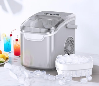 a grey ice maker next to a container of ice and drinks
