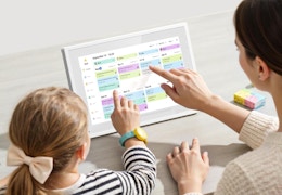 a mom and child using a smart calendar