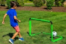 a kid with a franklin mini soccer goal