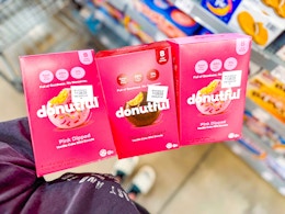 3 Donutful donut boxes held over Walmart shopping cart