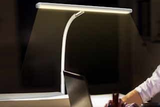 Airlonv LED Desk Lamp being used at a computer at night.