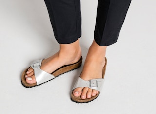 woman wearing silver birkenstock madrid leather sandals