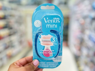 hand holding a pack of Gillette Venus Mini Razor