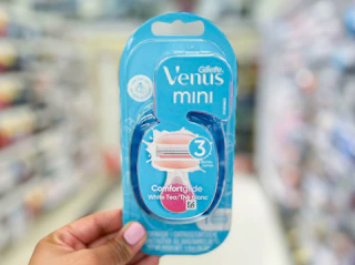 hand holding a pack of Gillette Venus Mini Razor