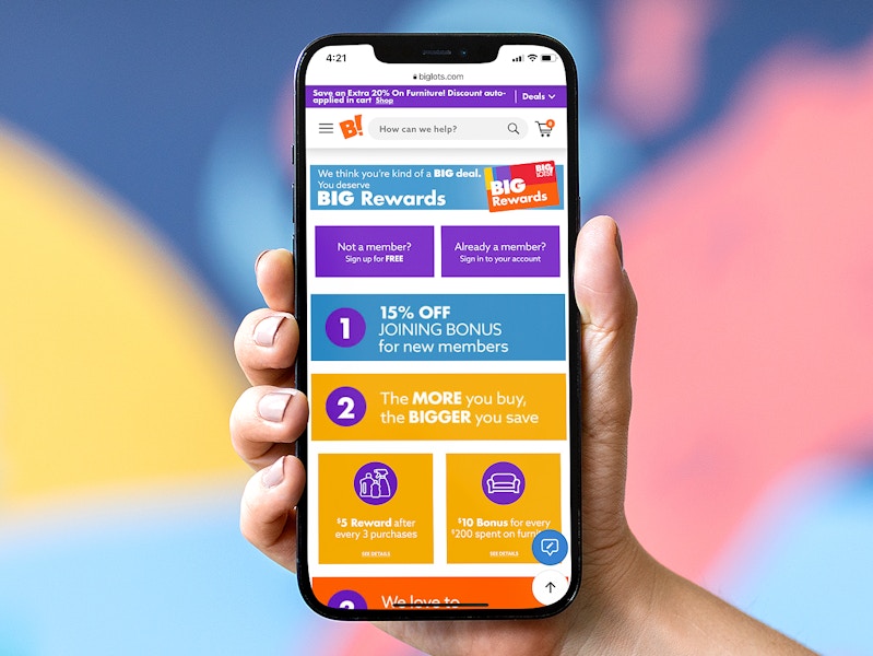 person holding phone showing big lots rewards membership information