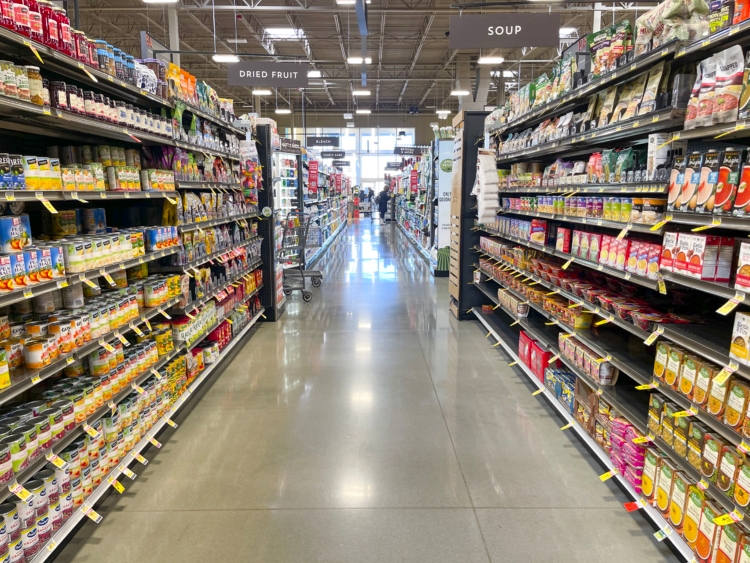A fully stocked grocery store aisle.