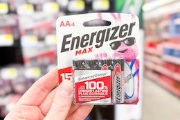 hand holding up a pack of energizer batteries