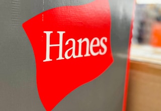 the red Hanes logo on the side of a gray box