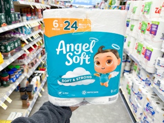 hand holding angel soft toilet paper in walgreens