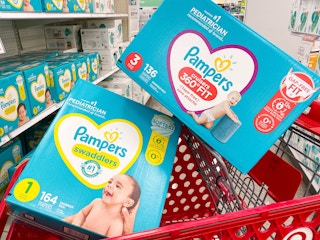 Two boxes of Pampers diapers stacked in a Target shopping cart