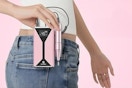 Woman holding a cordless nail file machine.