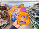 hand holding arm & hammer laundry items in walgreens