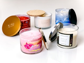 Five candles opened on a white backdrop